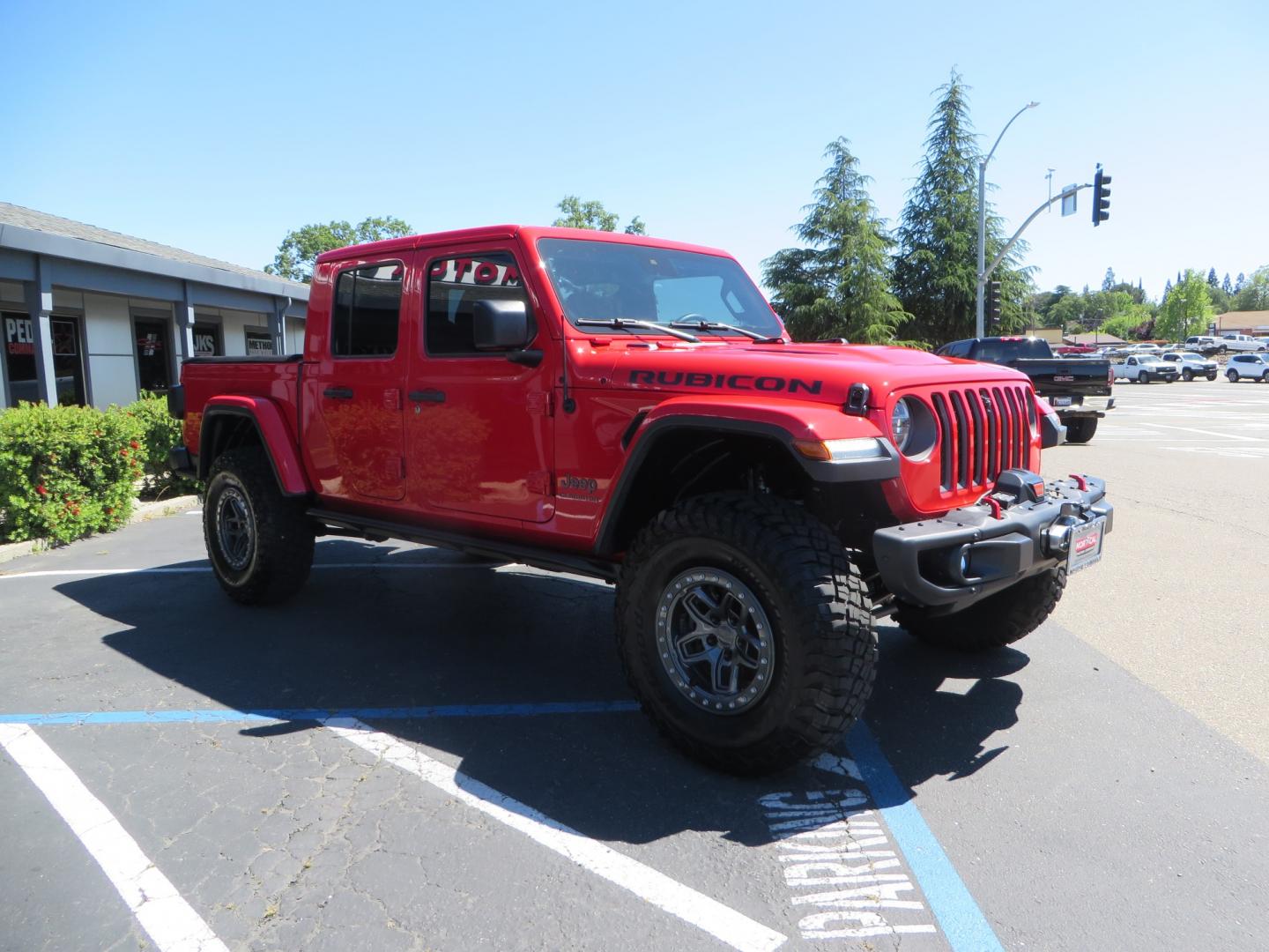 2020 Red /black Jeep Gladiator Rubicon (1C6JJTBG6LL) with an 3.6L V6 DOHC 24V engine, 6M transmission, located at 2630 Grass Valley Highway, Auburn, CA, 95603, (530) 508-5100, 38.937893, -121.095482 - Rubicon Gladiator featuring a Mopar suspension system with Fox shocks, 17" AEV wheels wrapped in 37" BFG tires, Warn Winch, Rock sliders, Cascade front license plate holder, Impact bedliner, Built Right Industries bed Molle panels, and Window tint. - Photo#2